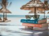 Pila de libros y gafas de sol sobre una mesa en la playa, representando la preparación flexible de exámenes oficiales de inglés B2 y C1 durante las vacaciones de verano
