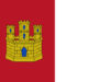 Bandera de Castilla-La Mancha con un castillo dorado sobre fondo rojo en la mitad izquierda y la mitad derecha en blanco